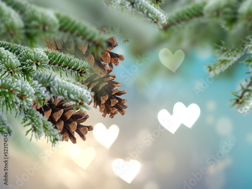 Christmas tree branch with cone and bokeh light heart sumbol gold bakcground template copy space photo