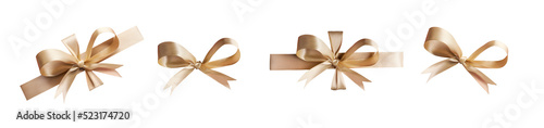 Obraz na płótnie A collection of gold ribbon bows for Christmas, birthday and valantines presents isolated against a transparent background. w salonie