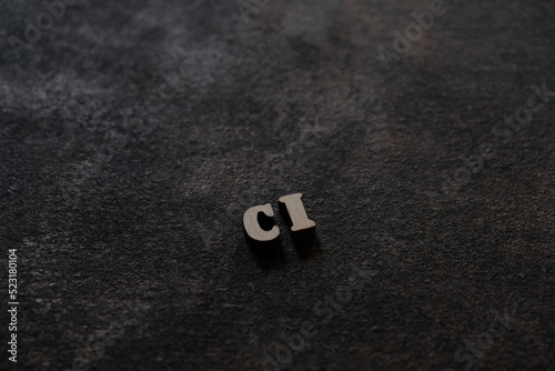 The letters C and I above the dark field. Initials CI