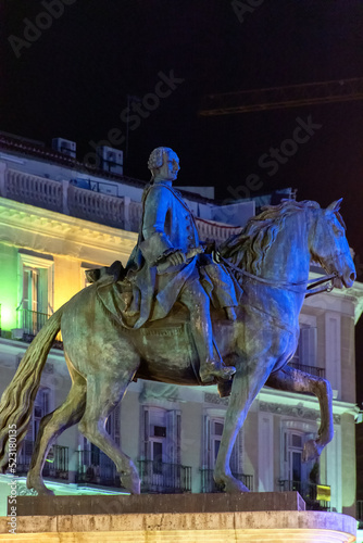 Estatua ecuestre del Rey Carlos III en la Puerta del Sol de Madrid, España photo