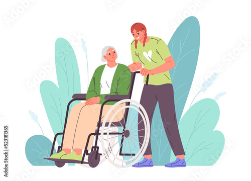 Woman takes care of elderly woman in wheelchair