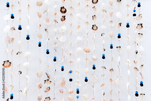 Seashells hanging from a thread