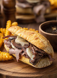 French dip sandwich and bowl of au jus