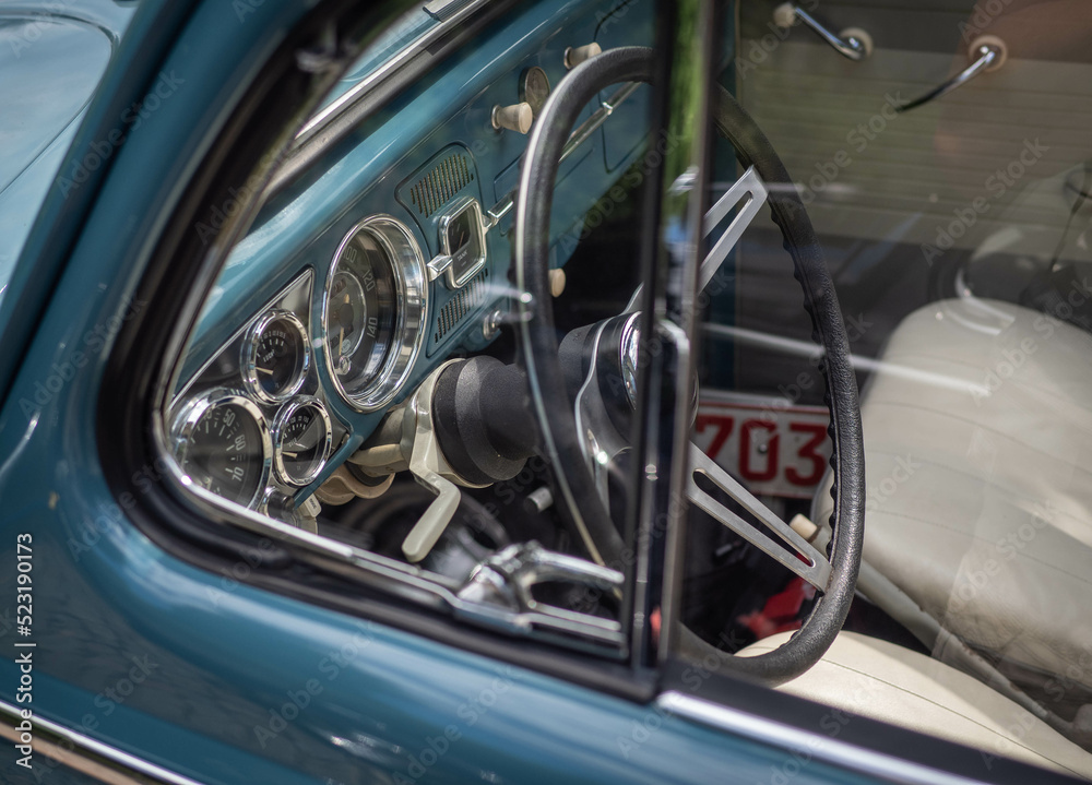 Dashboard and steering wheel of old-timer car

