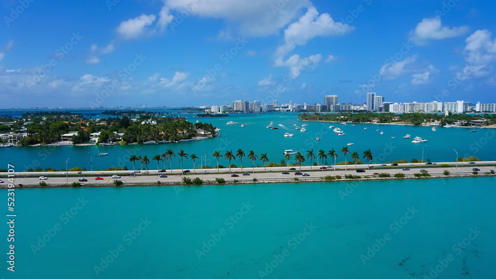 Aerial view of waterfront residential and office buildings Biscayne Bay on sunny cloudless morning in Miami, Florida.