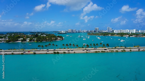 Obraz na płótnie Aerial view of waterfront residential and office buildings Biscayne Bay on sunny cloudless morning in Miami, Florida. w salonie