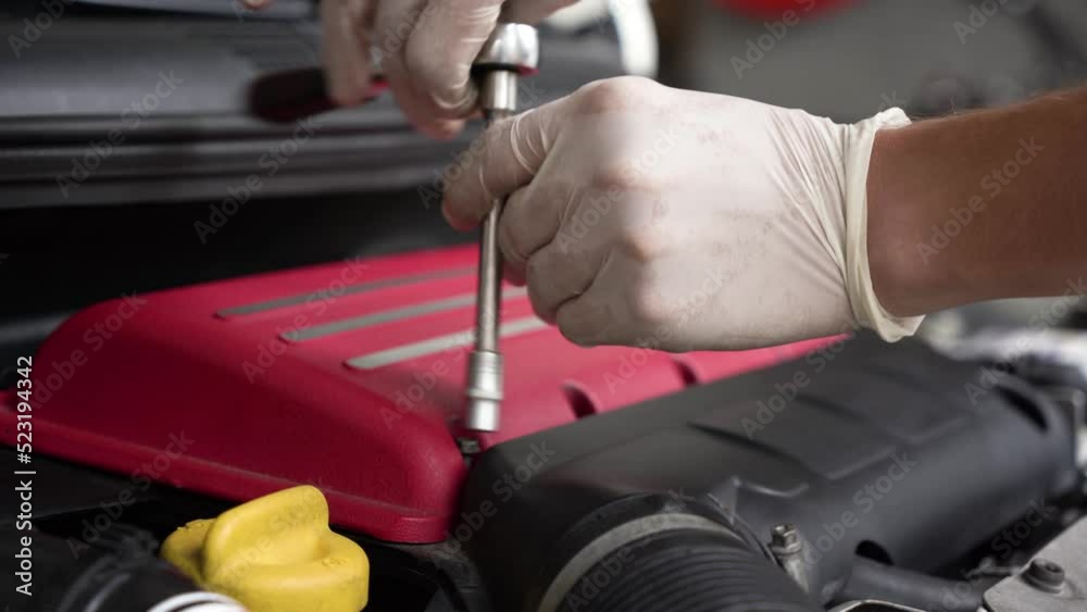 auto mechanic repairs car engine. car service. close-up. auto mechanic repairs car engine. car service. close-up.