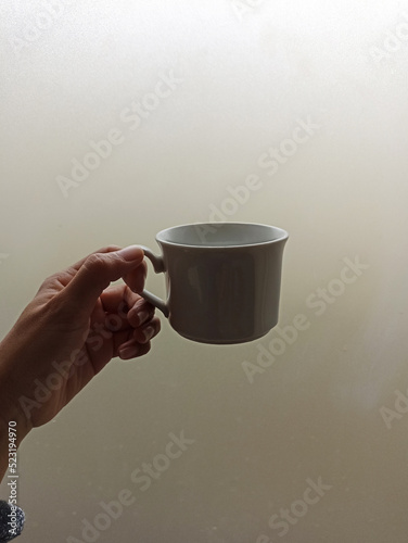 cup of coffee in hand