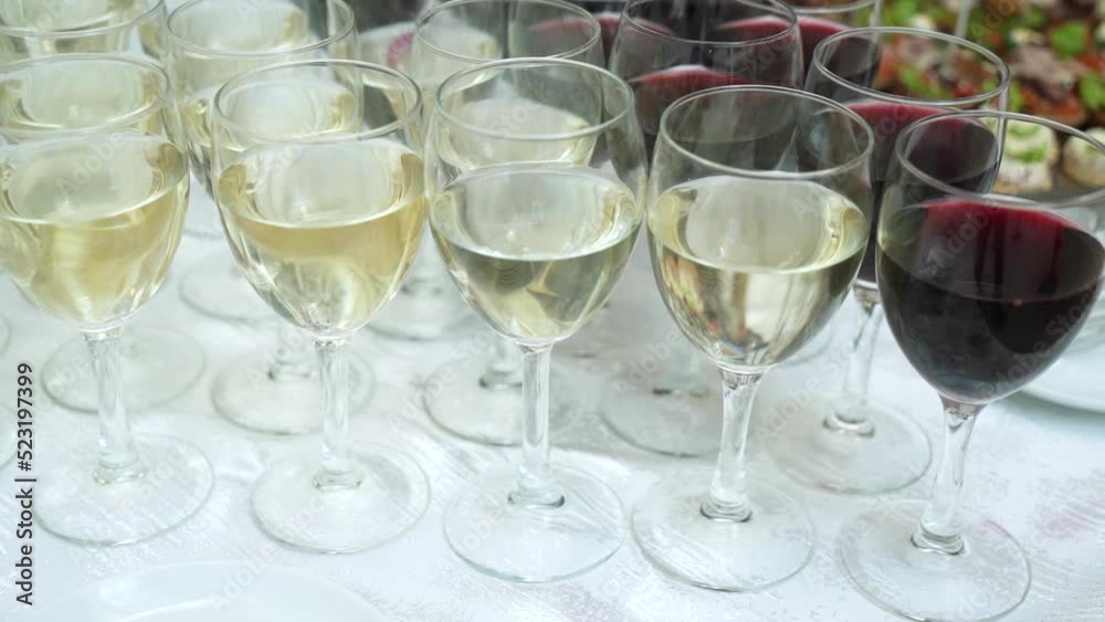 Wine. Row of wine glasses with poured alcohol at party banquet. close-up. Wine. Row of wine glasses with poured alcohol at party banquet. close-up.