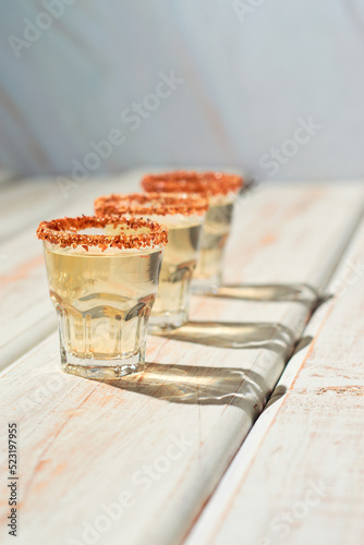 Mexican mezcal shot with chili pepper and orange