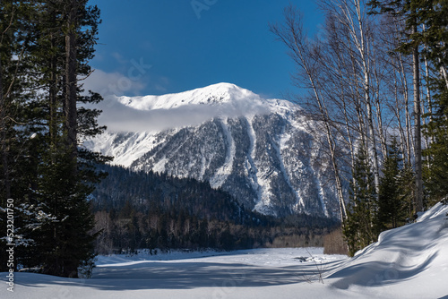 View of Taltsinsky peak and Snezhnaya river in Khamar-Daban mountains