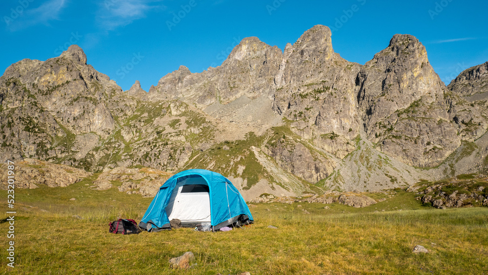 Bivouac in tent in the french alps with a view on the summit, near chamrousse