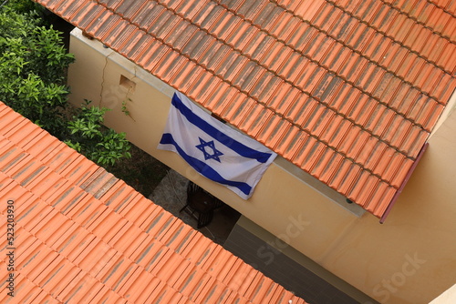 The blue and white Israeli flag with the Star of David.