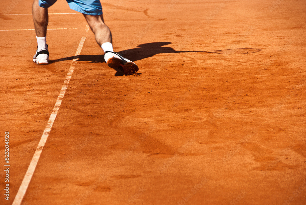 tennis player on a red clay court