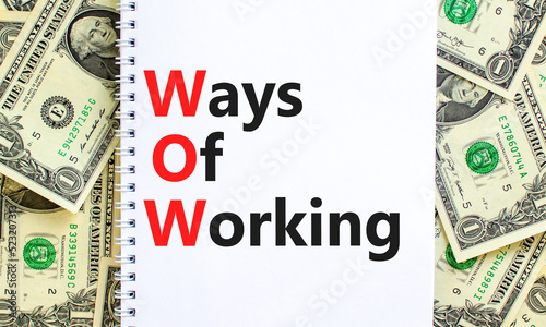 WOW ways of working symbol. Concept words WOW ways of working on white note on a beautiful background from dollar bills. Business and WOW ways of working concept. Copy space.