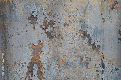 Shabby rusty metal fence as a background, old metal wall texture