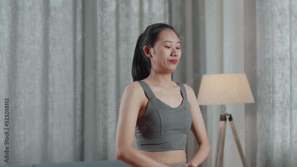 Young Asian Trainer Female In Sports Clothes Speaking And Stretching While Teaching Exercise At Home
Young Asian Trainer Female In Sports Clothes Speaking And Stretching While Teaching Exercise At Home