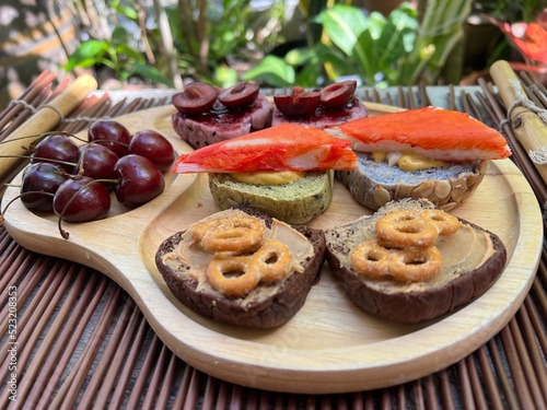 Crab strick and cherry mini toast with cherry and mini pretzel