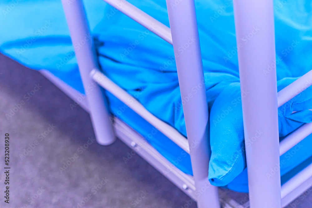 Fototapeta premium Dorm room bunk bed closeup blue sheets