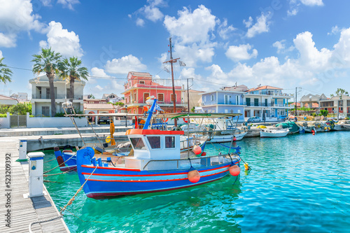 Landscape with fishing boats in port of Lixouri town, Kefalonia island, Greece photo