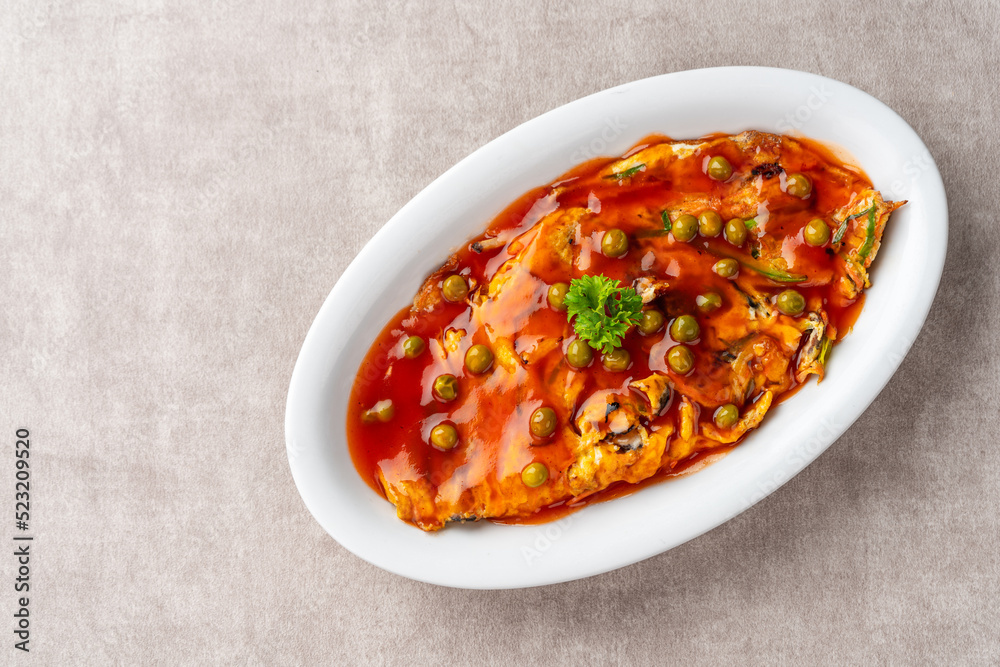 Fu yung hai, Puyonghai or egg foo young, a famous Chinese-style emelette dish in Indonesia. made from egg, vegetables and sauce Fu yung hai, Puyonghai or egg foo young, a famous Chinese-style emelette dish in Indonesia. made from egg, vegetables and sauce