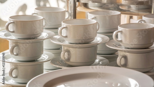 Cups, saucers and plates made of white earthenware