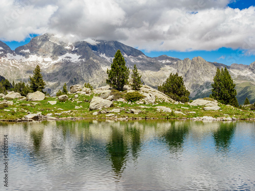 Perramo lake and Perdiguero peak at baclground in Benasque Valley, Spain © estivillml
