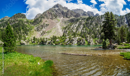 Escarpinosa green lake and waterfall in Benasque Valley, Spain photo