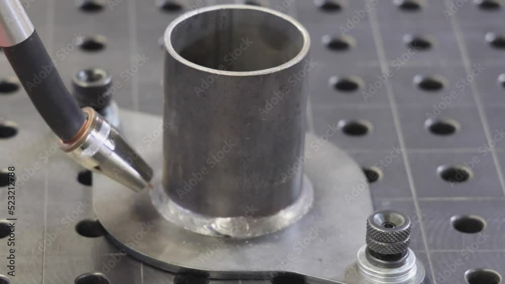 Metal Pipe Automated Welding Process Robotic Arm at Work Table