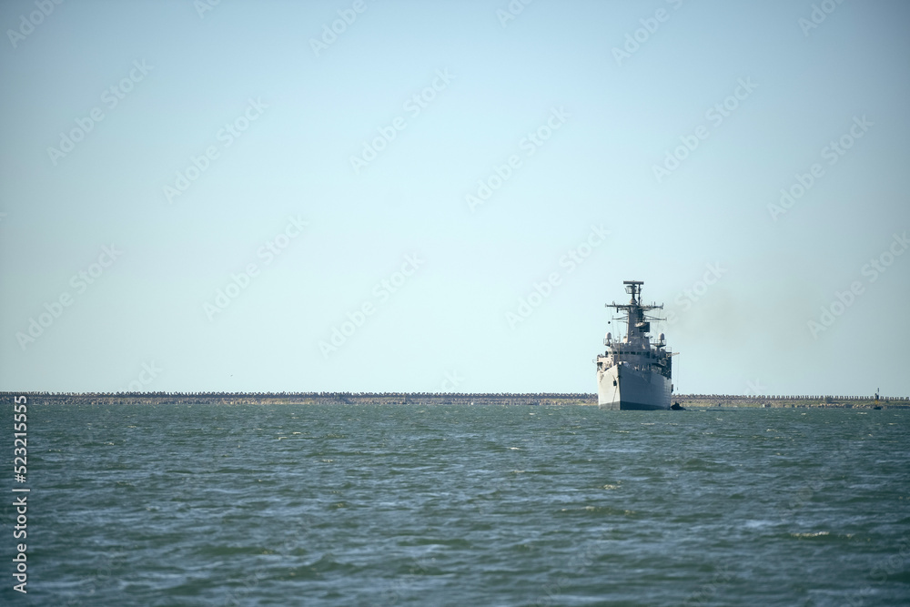 Warship sailing in still water