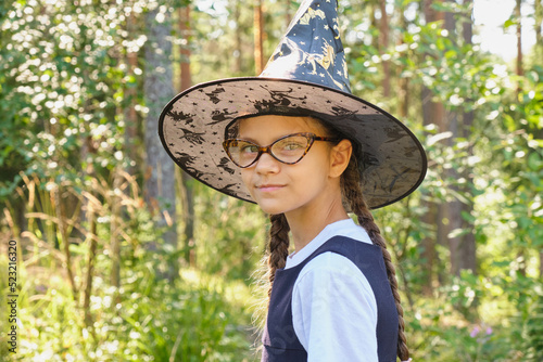 teen girl in a witch costume in the park © Natasha