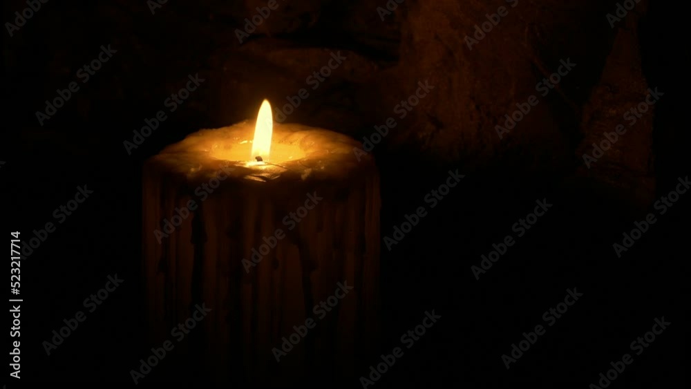 Medieval Candle Burning And Blown Out In The Dark