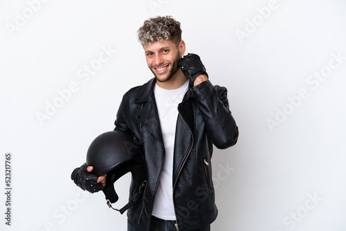 Young man with a motorcycle helmet isolated on white background laughing