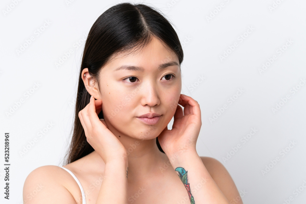 Young Chinese woman isolated on white background . Close up portrait Young Chinese woman isolated on white background . Close up portrait