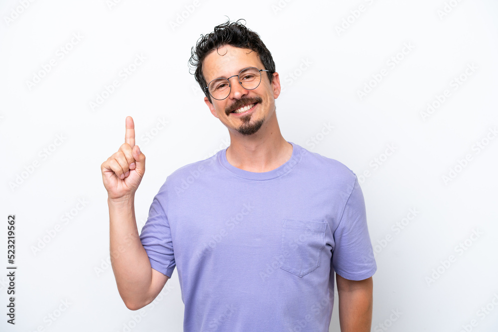 Young man with moustache isolated on white background showing and lifting a finger in sign of the best