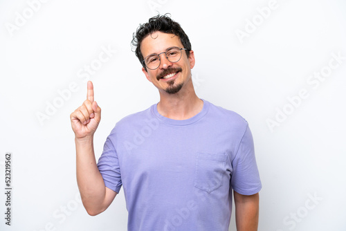 Young man with moustache isolated on white background showing and lifting a finger in sign of the best © luismolinero