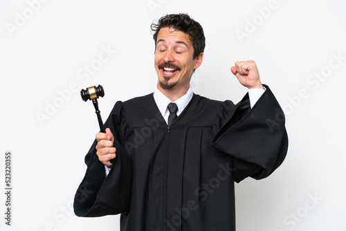 Young judge caucasian man isolated on white background celebrating a victory