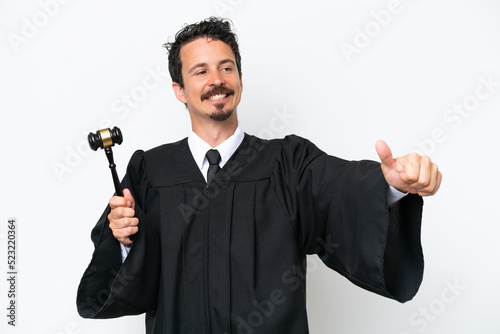 Young judge caucasian man isolated on white background giving a thumbs up gesture