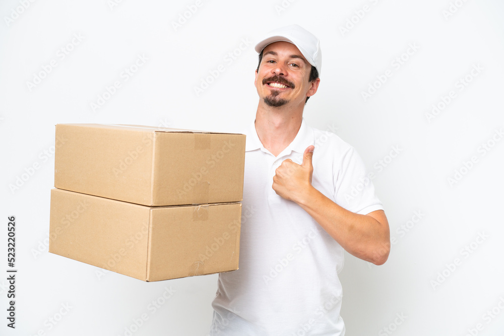 Delivery caucasian man isolated on white background giving a thumbs up gesture Delivery caucasian man isolated on white background giving a thumbs up gesture
