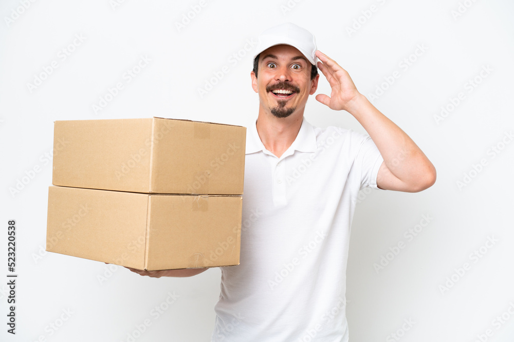 Delivery caucasian man isolated on white background with surprise expression Delivery caucasian man isolated on white background with surprise expression