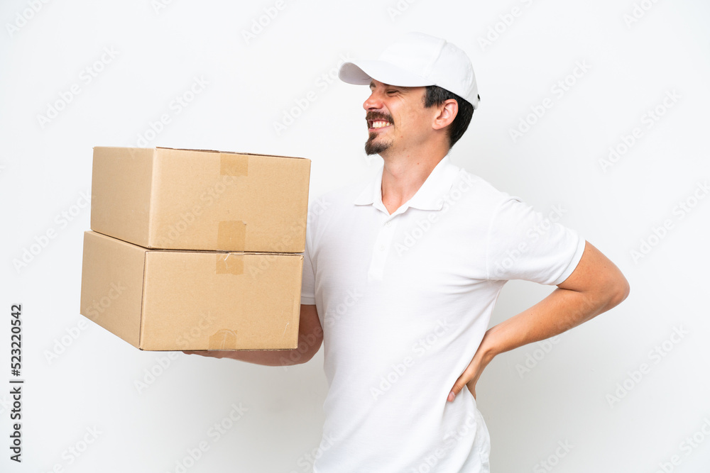 Delivery caucasian man isolated on white background suffering from backache for having made an effort Delivery caucasian man isolated on white background suffering from backache for having made an effort