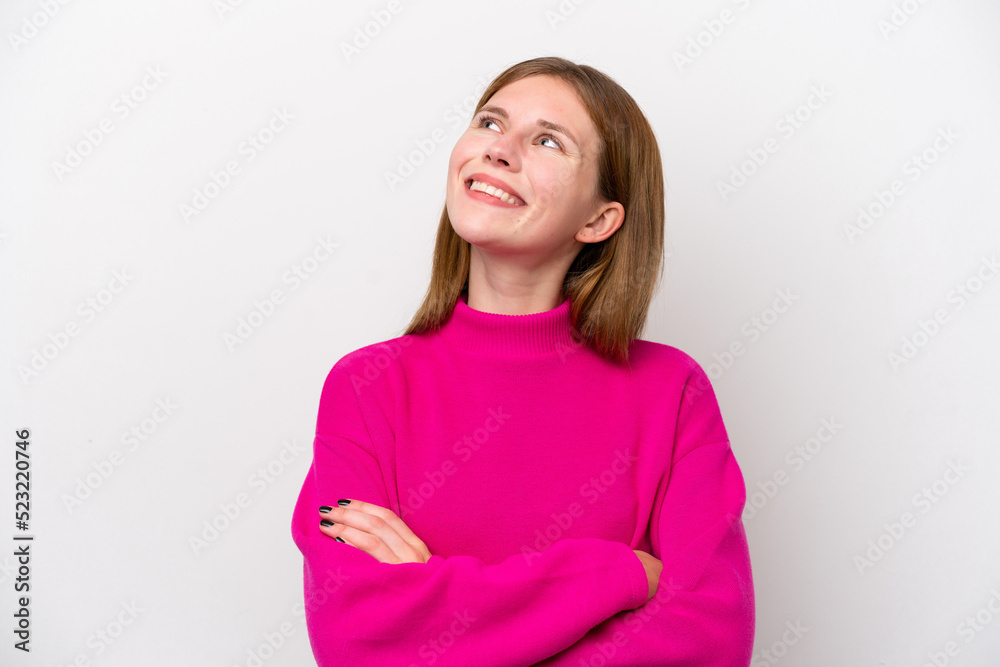 Young English woman isolated on white background looking up while smiling Young English woman isolated on white background looking up while smiling