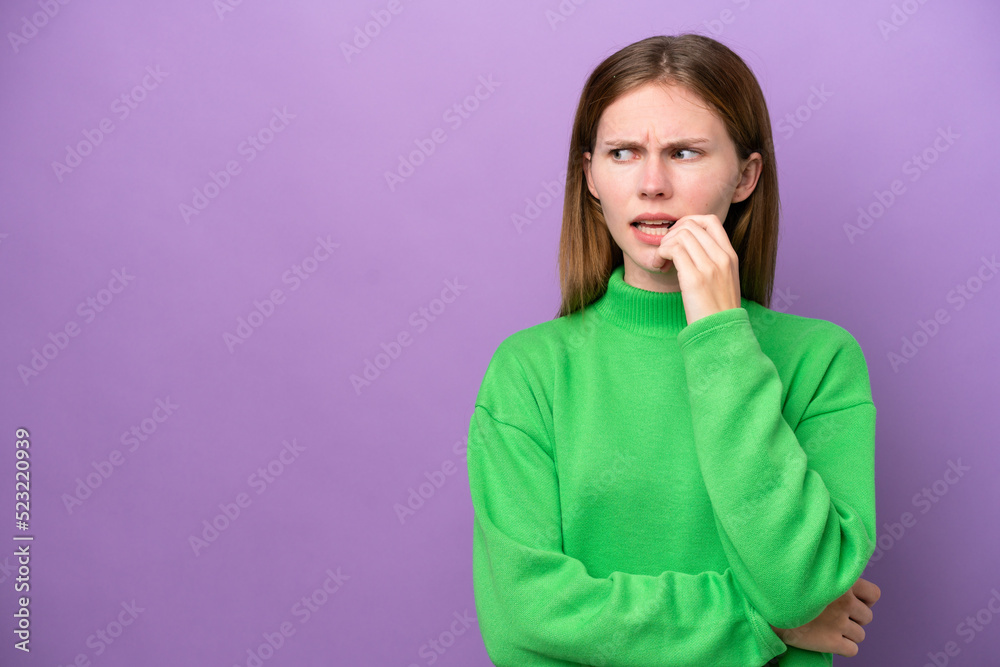 Young English woman isolated on purple background nervous and scared Young English woman isolated on purple background nervous and scared