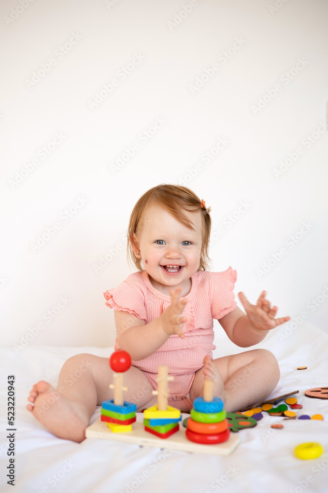 Emotional cute Baby is playing. Infant learning and development. Wooden eco-friendly educational toys. Montessori system. Emotional cute Baby is playing. Infant learning and development. Wooden eco-friendly educational toys. Montessori system.