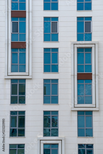 Modern high-rise building. A number of identical windows.
