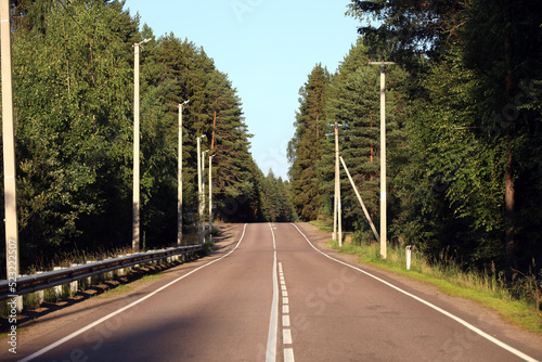 empty alfalt road in the afternoon in the forest photo