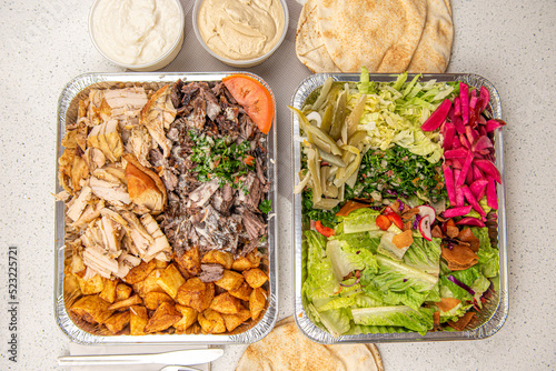 Meat and Chicken mix Shawarma Doner on a plate with Healthy vegetarian salad on white table background