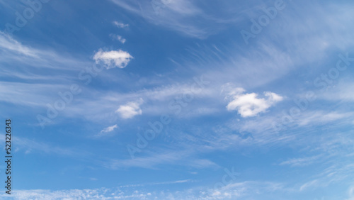 Fototapeta Naklejka Na Ścianę i Meble -  Blue sky with a few clouds background.