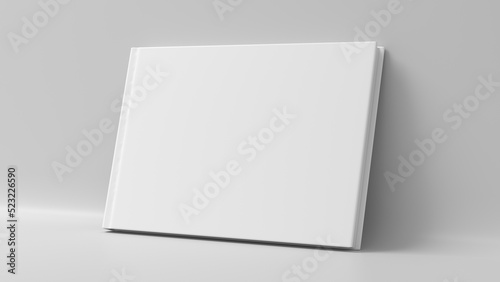 Blank horizontal hardcover book cover mockup standing on white background