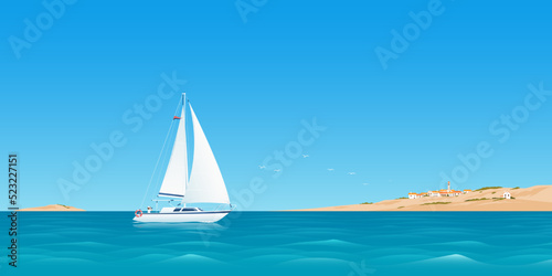 Traveling by sailboat at sea. Warm seascape with a sailboat. White sailboat and an island. Mediterranean sea photo